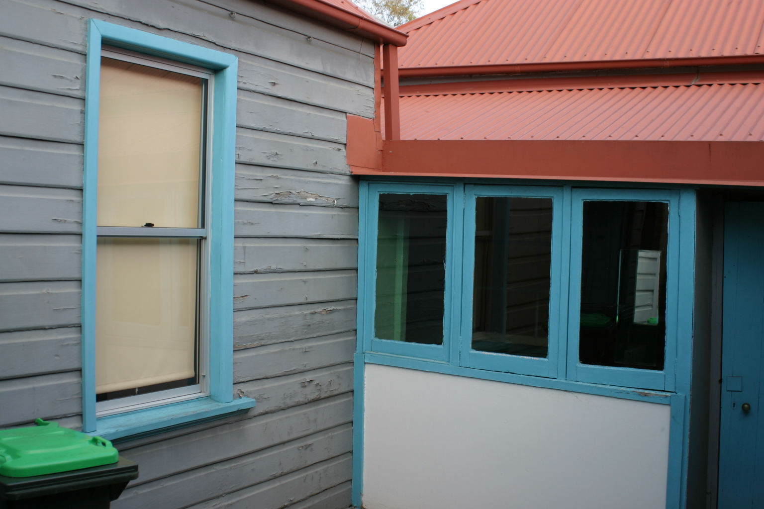 rear of house, sunroom windows.