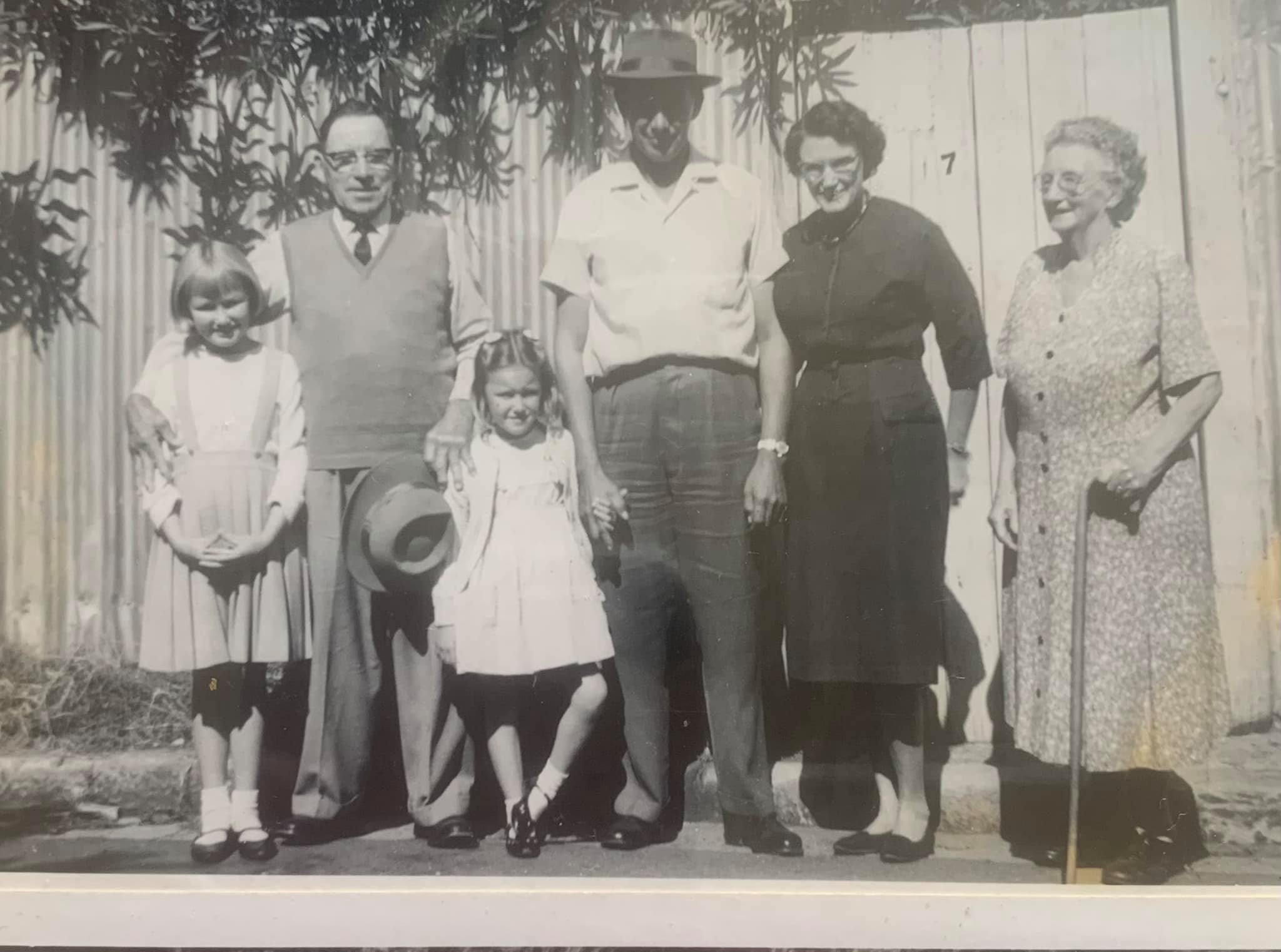 Family at the rear gate of 7 Theodore